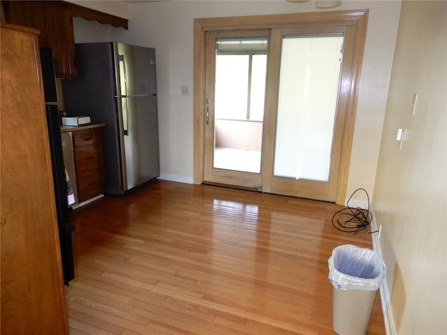 204 Stonebrook Dr, Peters Twp, PA 15317 - kitchen featuring freestanding refrigerator, light wood finished floors, and baseboards
