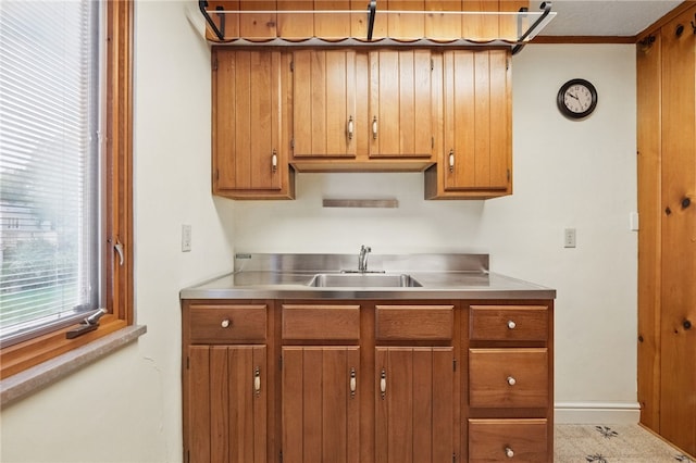 2600 Locust Ln, Hampton, PA 15101 - kitchen featuring stainless steel countertops, brown cabinets, a sink, and baseboards