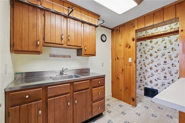 2600 Locust Ln, Hampton, PA 15101 - kitchen with a sink, brown cabinetry, stainless steel counters, and light floors