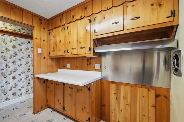 2600 Locust Ln, Hampton, PA 15101 - kitchen with light floors, light countertops, baseboards, and brown cabinetry
