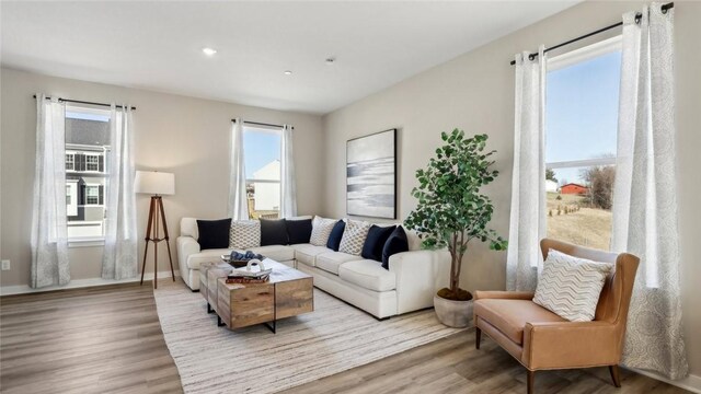 699 Olivia St, Collier Twp, PA 15205 - living room featuring wood finished floors, recessed lighting, and baseboards