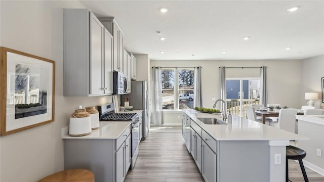 699 Olivia St, Collier Twp, PA 15205 - kitchen featuring a sink, gray cabinetry, appliances with stainless steel finishes, light countertops, and recessed lighting