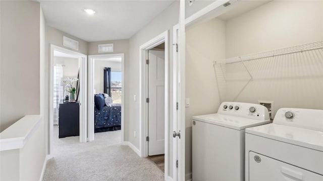 699 Olivia St, Collier Twp, PA 15205 - washroom featuring separate washer and dryer, light carpet, and baseboards