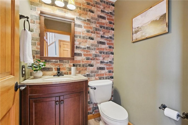 807 Rembrandt Cir, Hempfield Twp Wml, PA 15642 - half bathroom with toilet, vanity, and brick wall
