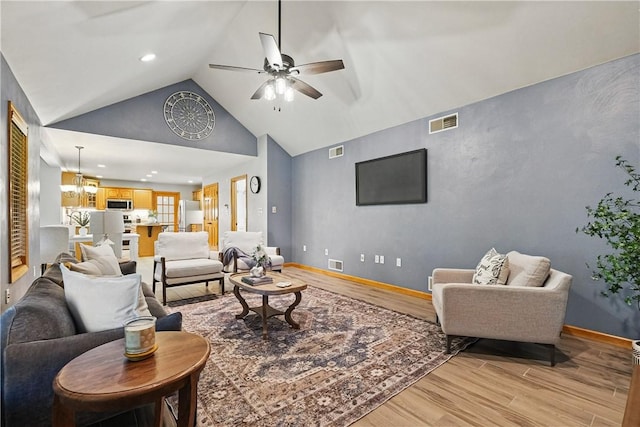 807 Rembrandt Cir, Hempfield Twp Wml, PA 15642 - living room with light wood-type flooring, lofted ceiling, a ceiling fan, baseboards, and recessed lighting