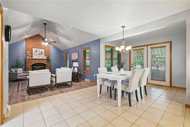 807 Rembrandt Cir, Hempfield Twp Wml, PA 15642 - dining space featuring a chandelier, ceiling fan, a brick fireplace, baseboards, and light tile patterned flooring