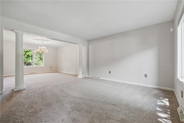 807 Rembrandt Cir, Hempfield Twp Wml, PA 15642 - carpeted empty room with ornate columns, a chandelier, and baseboards