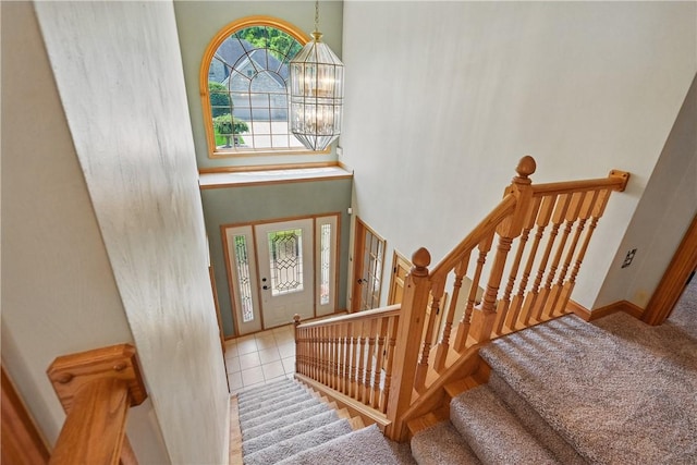 807 Rembrandt Cir, Hempfield Twp Wml, PA 15642 - tiled entryway with a chandelier, stairs, and baseboards