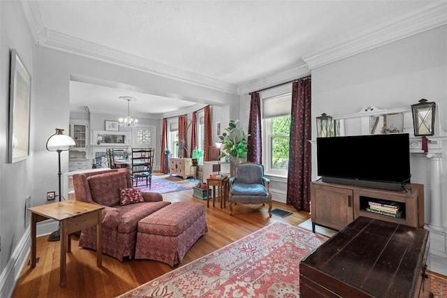 241 S Atlantic Ave, Friendship Park, PA 15224 - living room with wood finished floors, a chandelier, ornamental molding, and baseboards