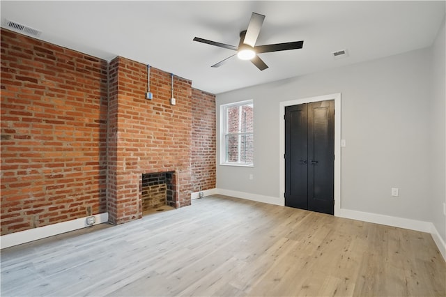 346 45th St, Lawrenceville, PA 15201 - unfurnished living room featuring a ceiling fan, wood finished floors, baseboards, and a fireplace