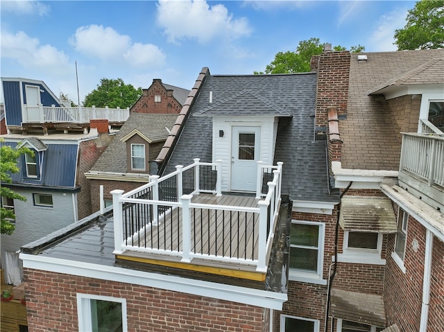346 45th St, Lawrenceville, PA 15201 - rear view of property featuring a balcony, a shingled roof, and brick siding