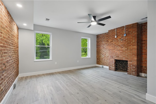 346 45th St, Lawrenceville, PA 15201 - unfurnished living room with brick wall, plenty of natural light, a ceiling fan, wood finished floors, and recessed lighting