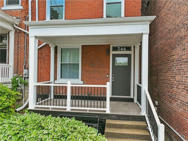 346 45th St, Lawrenceville, PA 15201 - doorway to property with brick siding and a porch