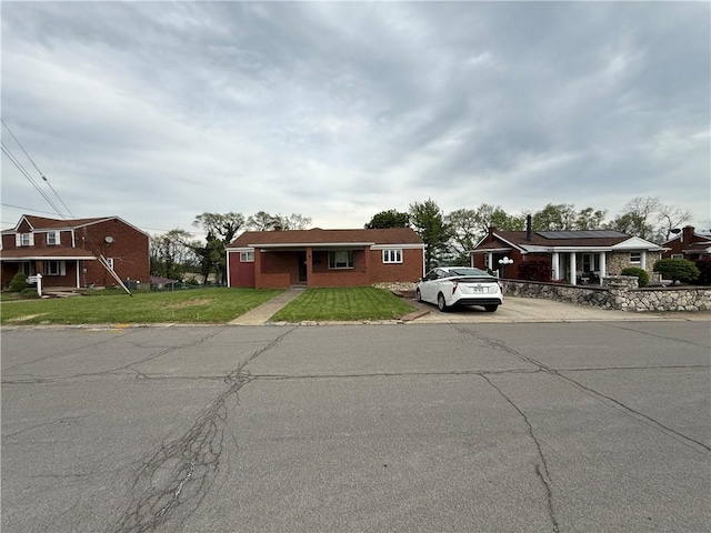 201 Lebanon Manor Dr, West Mifflin, PA 15122 - view of front of home with a front yard and concrete driveway