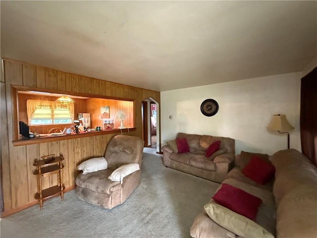 201 Lebanon Manor Dr, West Mifflin, PA 15122 - carpeted living room with wooden walls and arched walkways