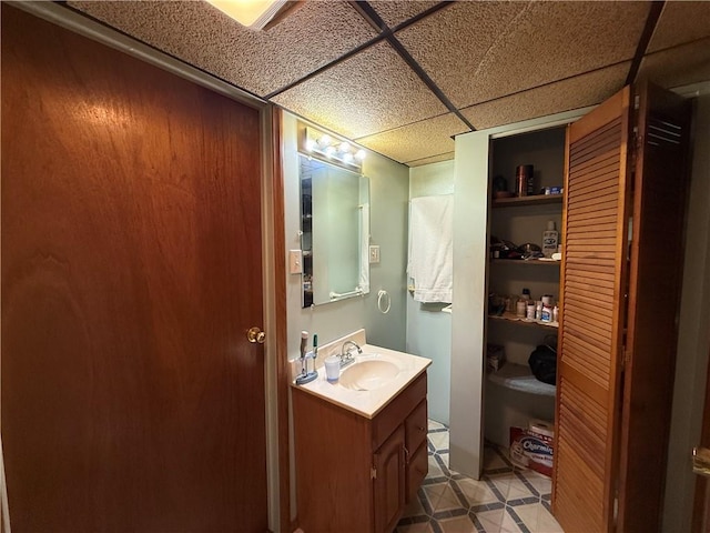 201 Lebanon Manor Dr, West Mifflin, PA 15122 - bathroom featuring a drop ceiling, vanity, and tile patterned floors