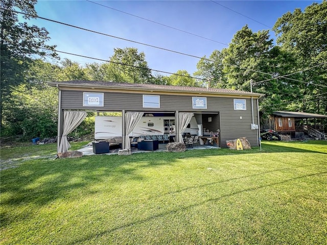 126 Dockside Ln, Bradys Bend Twp, PA 16028 - rear view of house featuring an outdoor living space, a lawn, and a patio area