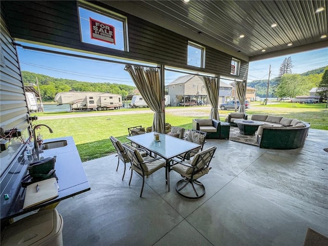 126 Dockside Ln, Bradys Bend Twp, PA 16028 - view of patio featuring a sink, an outdoor fire pit, and outdoor dining space
