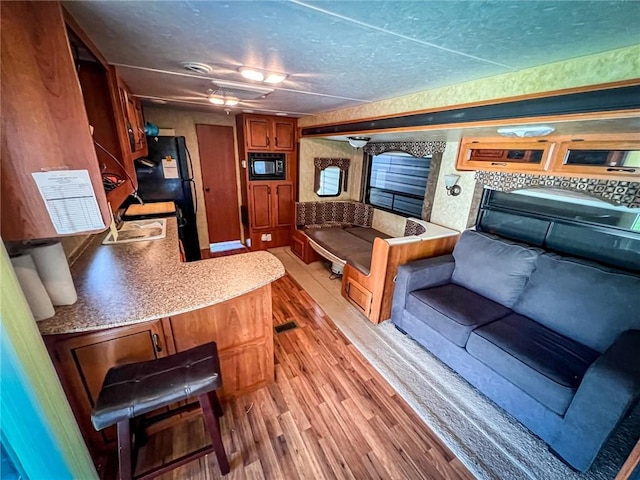 126 Dockside Ln, Bradys Bend Twp, PA 16028 - living area featuring light wood-type flooring and a textured ceiling