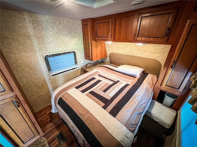 126 Dockside Ln, Bradys Bend Twp, PA 16028 - bedroom featuring dark wood-style floors and a wall mounted air conditioner