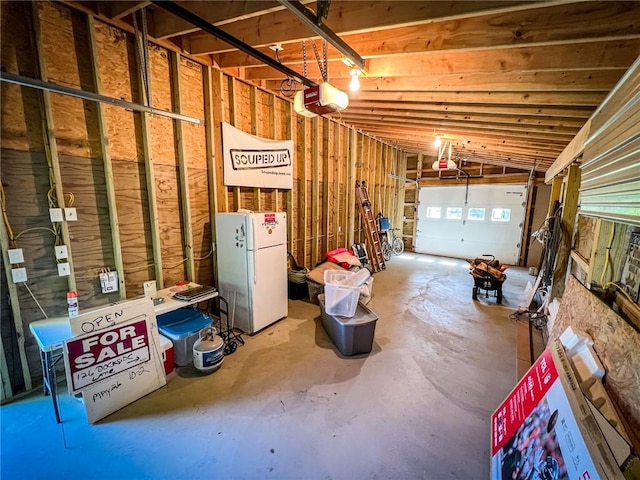 126 Dockside Ln, Bradys Bend Twp, PA 16028 - garage featuring freestanding refrigerator and a garage door opener
