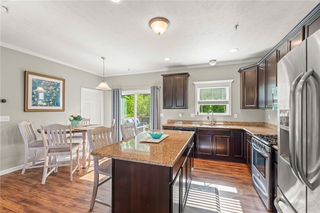 210 Brae Glen Dr, North Strabane, PA 15317 - kitchen with appliances with stainless steel finishes, a sink, dark brown cabinets, crown molding, and wood finished floors