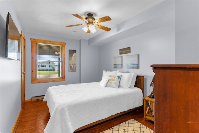 7832 Chase Dr, Shenango-Cra, PA 16134 - bedroom with baseboard heating, wood finished floors, baseboards, and ceiling fan