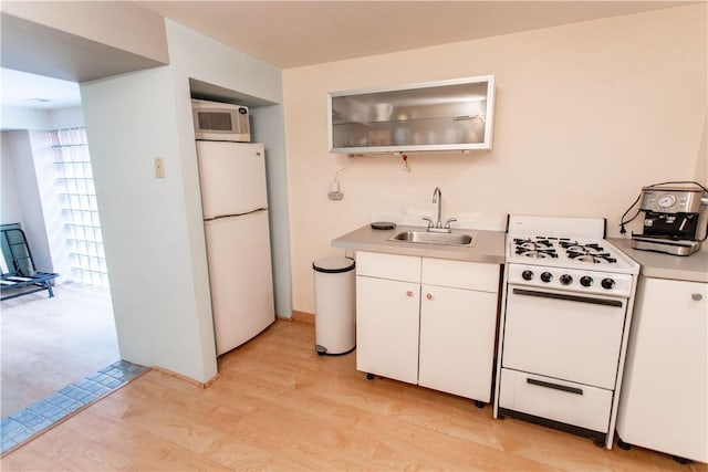 6542 Dalzell Pl, Squirrel Hill, PA 15217 - kitchen featuring white appliances, a sink, light wood-style floors, white cabinetry, and light countertops