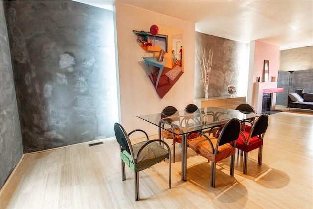 6542 Dalzell Pl, Squirrel Hill, PA 15217 - dining area featuring wood finished floors and a fireplace