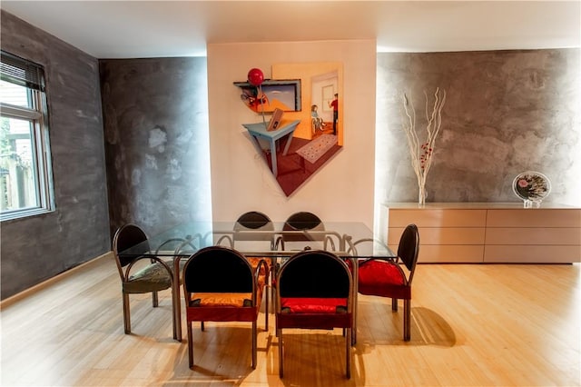 6542 Dalzell Pl, Squirrel Hill, PA 15217 - dining space with wood finished floors and an accent wall
