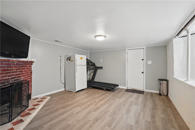 2023 Conlin St, West Mifflin, PA 15122 - workout room featuring wood finished floors, a fireplace, and baseboards