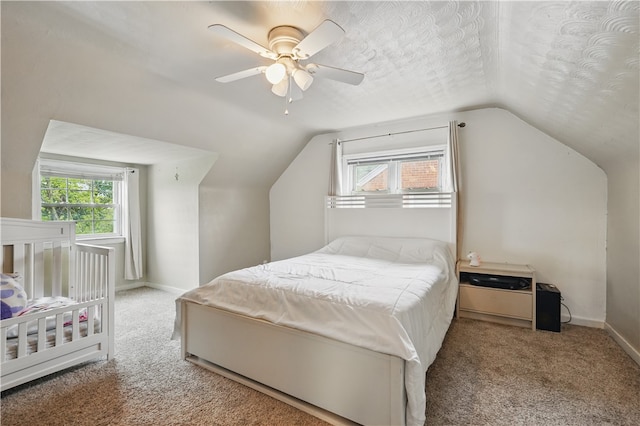 2023 Conlin St, West Mifflin, PA 15122 - carpeted bedroom featuring lofted ceiling, multiple windows, baseboards, and ceiling fan
