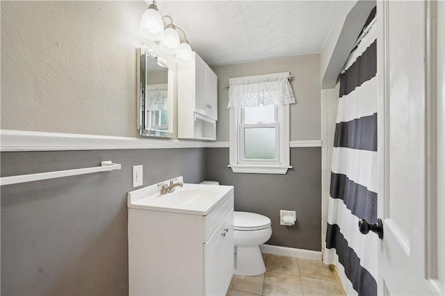 2023 Conlin St, West Mifflin, PA 15122 - full bathroom with vanity, toilet, baseboards, tile patterned flooring, and a shower with curtain