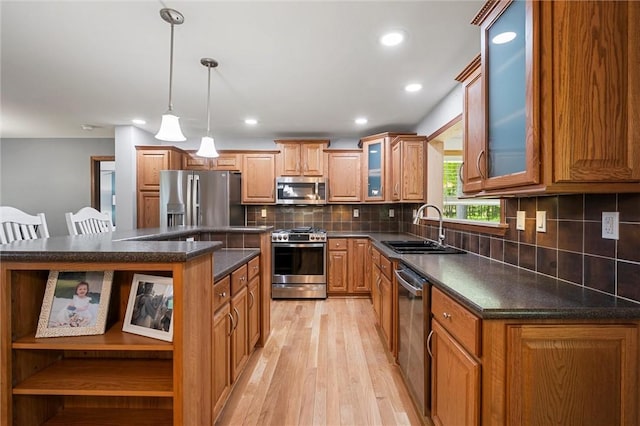 310 Laurel Ln, Leeper, PA 16233 - kitchen with appliances with stainless steel finishes, a sink, light wood-style flooring, open shelves, and a kitchen island