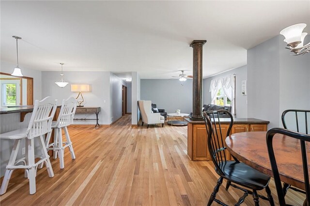 310 Laurel Ln, Leeper, PA 16233 - dining space featuring light wood finished floors, decorative columns, and ceiling fan