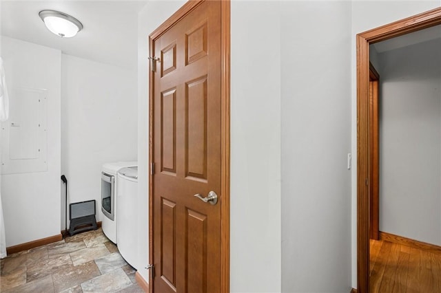 310 Laurel Ln, Leeper, PA 16233 - laundry room featuring separate washer and dryer, baseboards, and light stone finish flooring