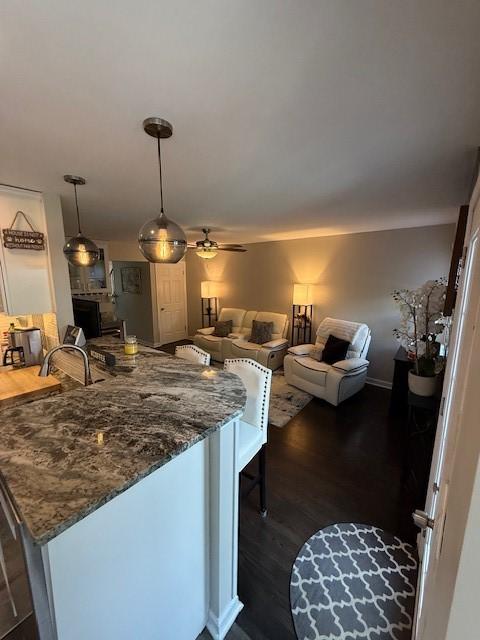 204 Thornberry Cir, Mt Lebanon, PA 15234 - kitchen with dark wood-style floors, dark stone counters, open floor plan, and ceiling fan