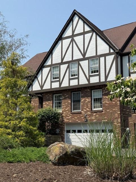204 Thornberry Cir, Mt Lebanon, PA 15234 - view of property exterior featuring a garage, stucco siding, and brick siding