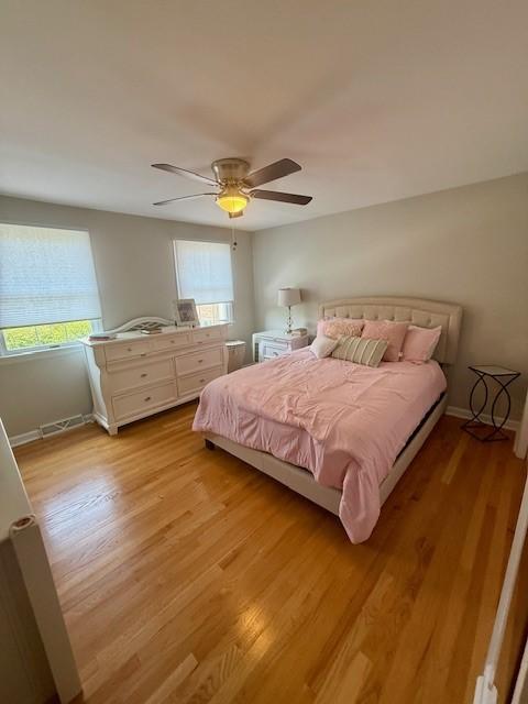 204 Thornberry Cir, Mt Lebanon, PA 15234 - bedroom with multiple windows, light wood-style flooring, a ceiling fan, and baseboards