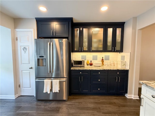 204 Thornberry Cir, Mt Lebanon, PA 15234 - kitchen featuring stainless steel refrigerator with ice dispenser, light stone countertops, glass insert cabinets, tasteful backsplash, and baseboards