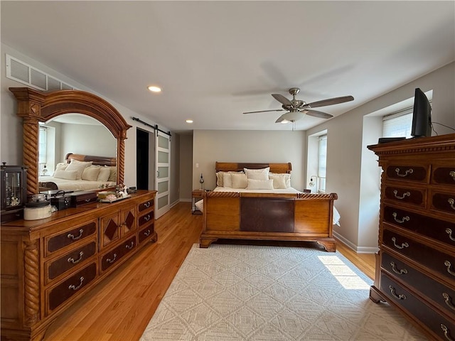 204 Thornberry Cir, Mt Lebanon, PA 15234 - bedroom featuring a barn door, light wood-style flooring, baseboards, a ceiling fan, and recessed lighting