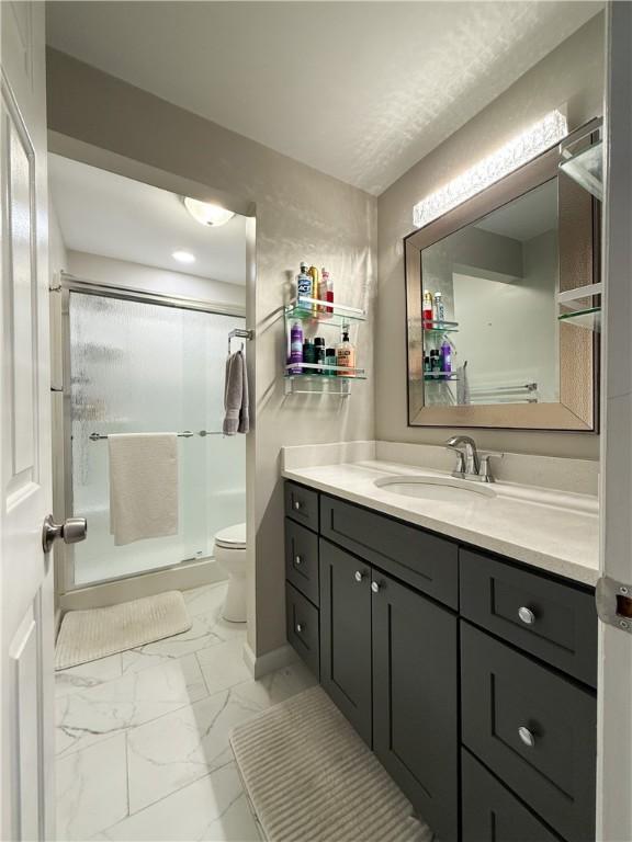 204 Thornberry Cir, Mt Lebanon, PA 15234 - full bath featuring marble look tiles, vanity, toilet, and a shower with door
