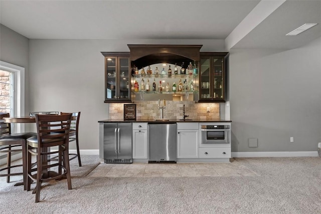 301 Chinquapin Ln, Marshall, PA 15090 - indoor wet bar with appliances with stainless steel finishes, light carpet, backsplash, and baseboards