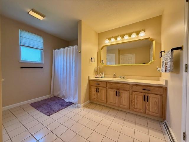 116 Valleycrest Dr, Cecil, PA 15321 - bathroom featuring a baseboard heating unit, vanity, tile patterned flooring, curtained shower, and baseboards