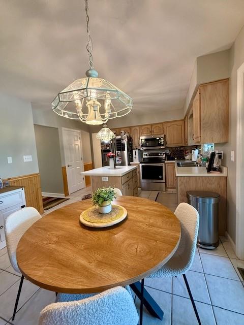 116 Valleycrest Dr, Cecil, PA 15321 - dining space with a chandelier, light tile patterned floors, and a wainscoted wall