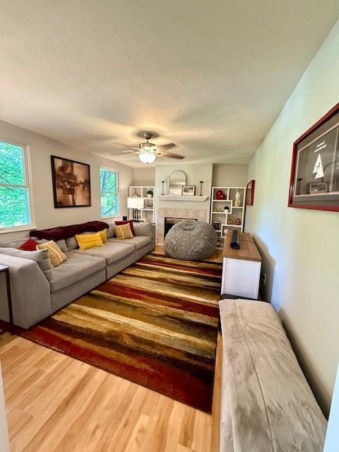 116 Valleycrest Dr, Cecil, PA 15321 - living area featuring plenty of natural light, a fireplace, and wood finished floors