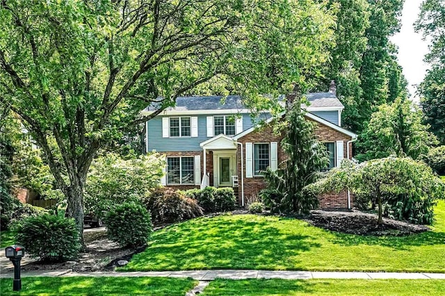 108 Vanita Dr, Moon/Crescent Twp, PA 15108 - view of front facade featuring brick siding and a front yard
