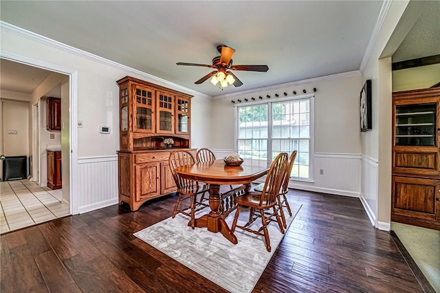 108 Vanita Dr, Moon/Crescent Twp, PA 15108 - dining room featuring dark wood-style floors, wainscoting, ceiling fan, and crown molding