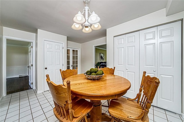 108 Vanita Dr, Moon/Crescent Twp, PA 15108 - dining space with light tile patterned floors and a chandelier