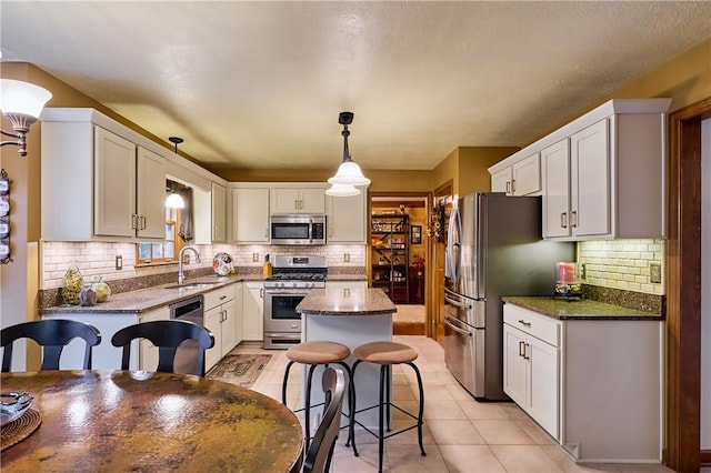 510 Fair Vista Ct, Pine Twp Nal, PA 15090 - kitchen featuring appliances with stainless steel finishes, a sink, tasteful backsplash, and white cabinets